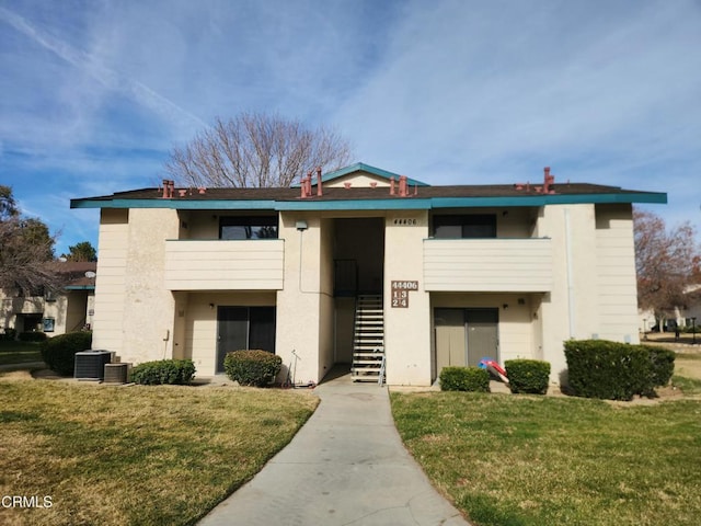 view of building exterior featuring central AC unit