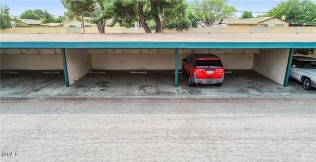 view of parking with a carport