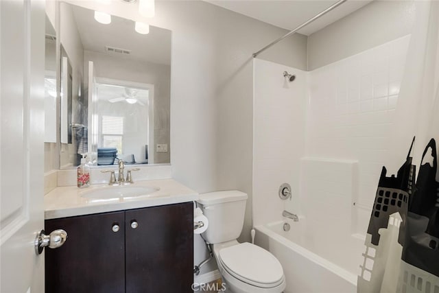 full bathroom featuring shower / bathing tub combination, vanity, ceiling fan, and toilet