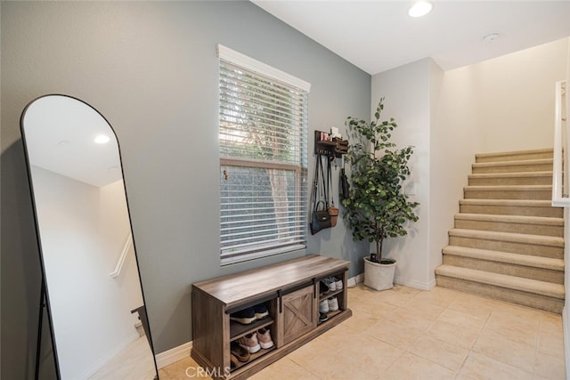 entrance foyer featuring light tile patterned floors