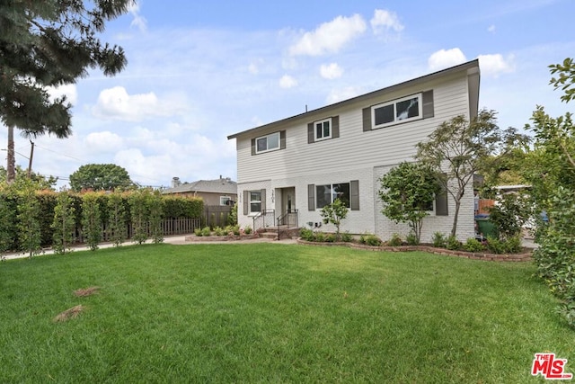 view of front of property with a front lawn