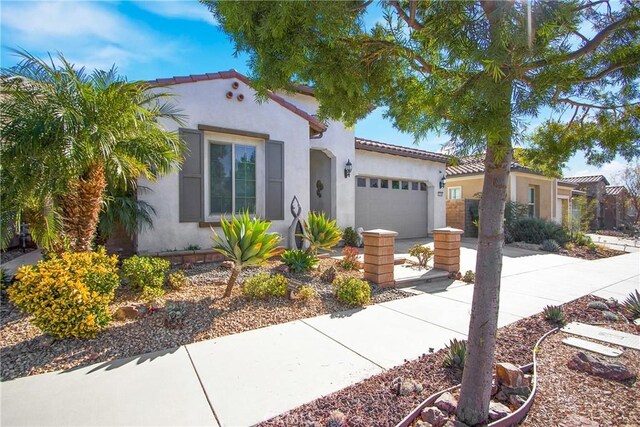 mediterranean / spanish-style home featuring a garage