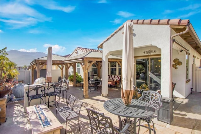 view of patio / terrace with a mountain view and outdoor lounge area