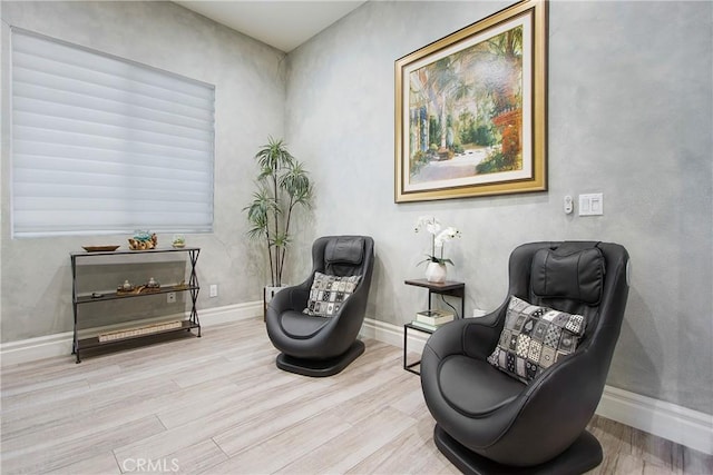 living area with light hardwood / wood-style floors