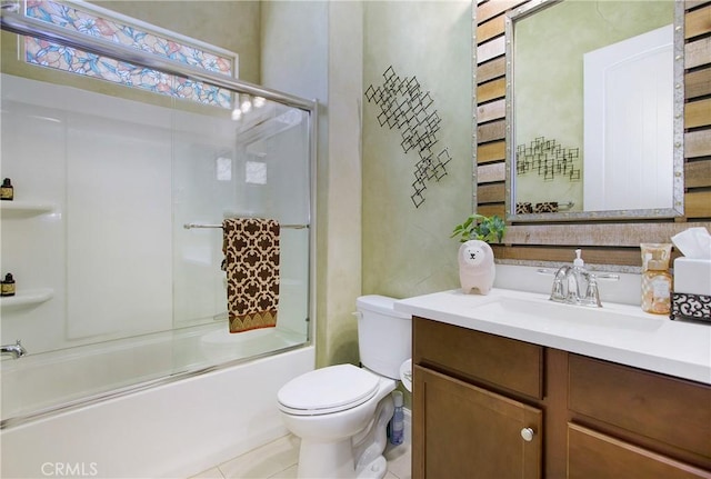 full bathroom featuring bath / shower combo with glass door, toilet, and vanity