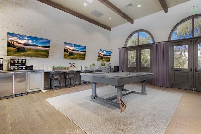 rec room featuring pool table, beam ceiling, and high vaulted ceiling