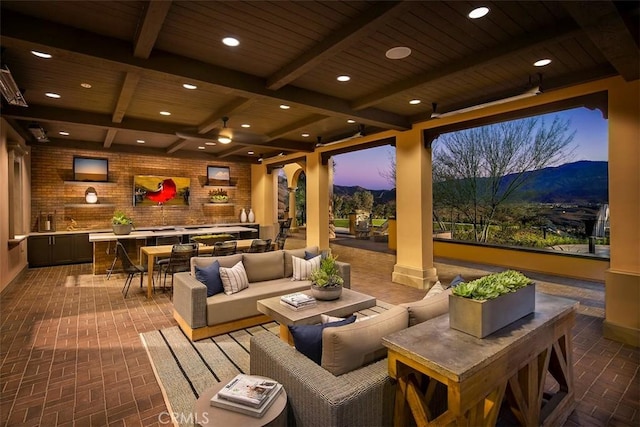 24368 Overlook Dr, Corona, CA 92883 - patio terrace at dusk featuring a mountain view, an outdoor living space, and outdoor dining space