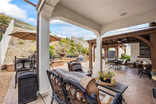 24368 Overlook Dr, Corona, CA 92883 - view of patio featuring outdoor dining area, a fenced backyard, and a gazebo