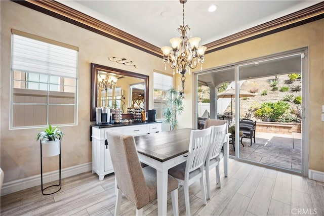 24368 Overlook Dr, Corona, CA 92883 - dining space with ornamental molding, a chandelier, and light wood-type flooring