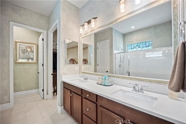 24368 Overlook Dr, Corona, CA 92883 - bathroom with baseboards, double vanity, a sink, and walk in shower