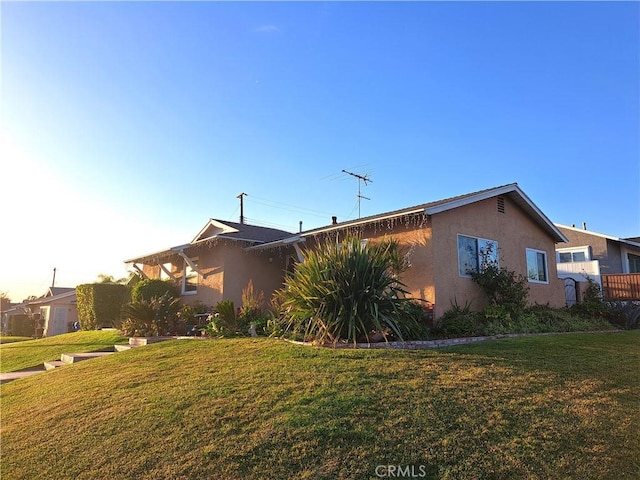 view of home's exterior featuring a yard