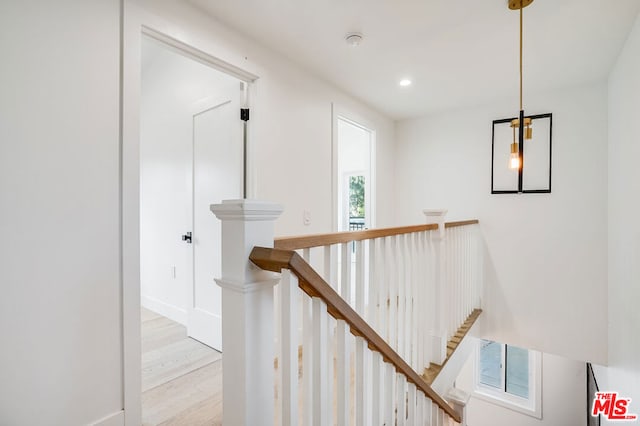 stairs with wood-type flooring