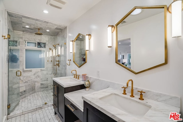 bathroom featuring walk in shower and vanity