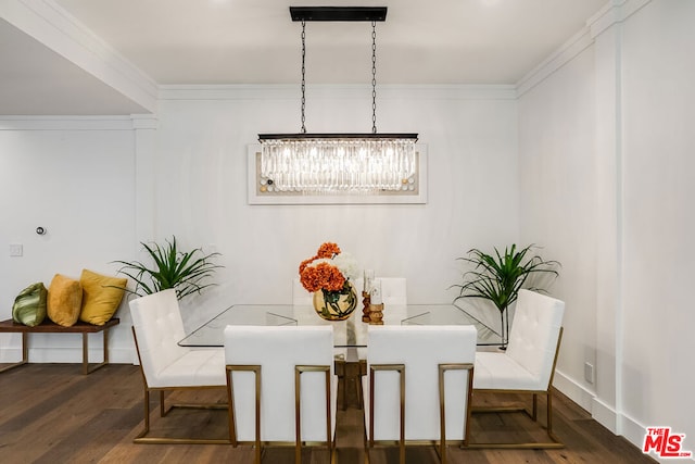 dining space with crown molding and dark hardwood / wood-style flooring