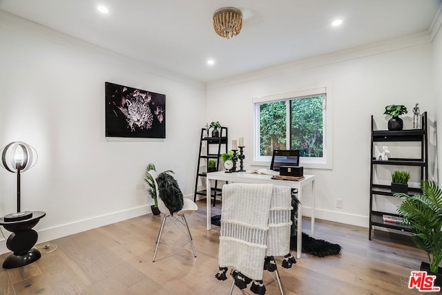 home office featuring crown molding and light hardwood / wood-style flooring