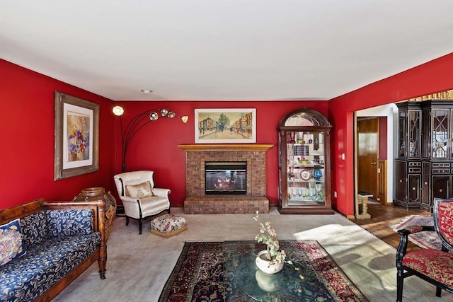 carpeted living room with a fireplace