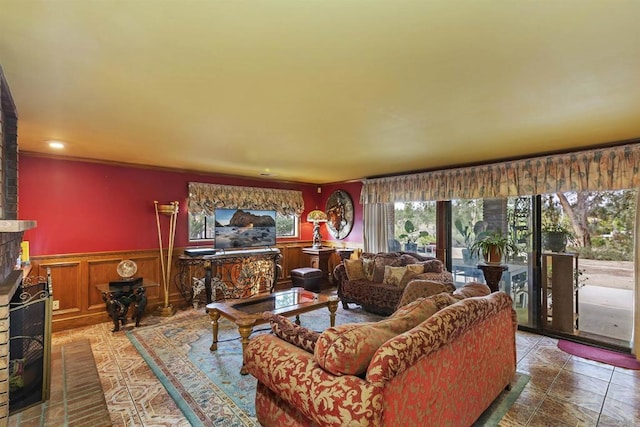 living room featuring a brick fireplace