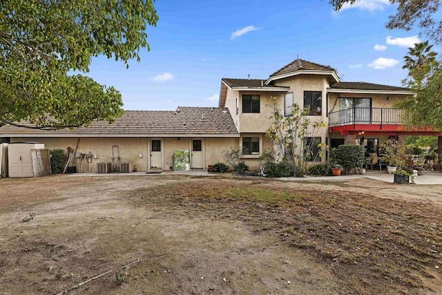 view of front of home featuring a patio area and central AC