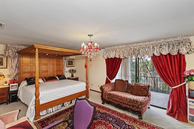 carpeted bedroom with an inviting chandelier and access to exterior