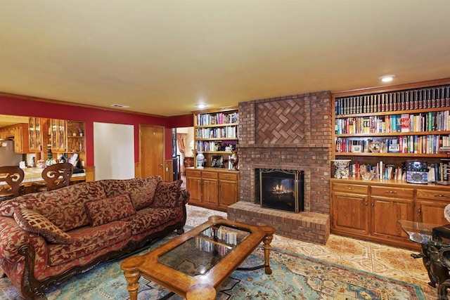 living room featuring a fireplace and built in features