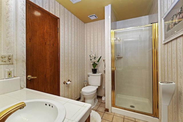 bathroom with vanity, tile patterned flooring, toilet, and a shower with shower door