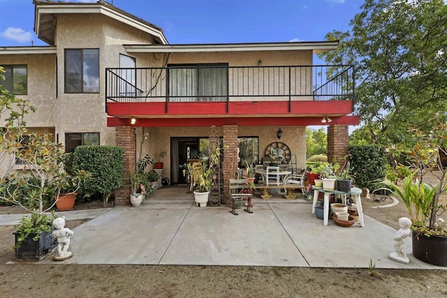 back of house featuring a patio area