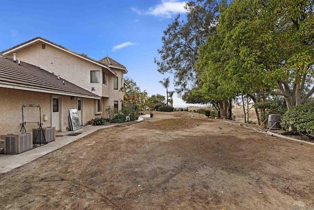 view of yard with central AC