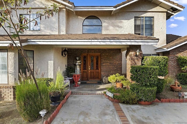 doorway to property featuring covered porch