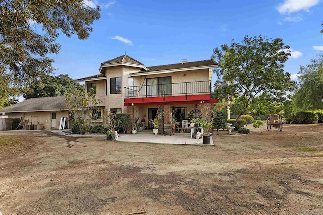 back of property with a patio area