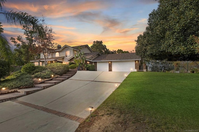 view of front facade featuring a yard and a garage