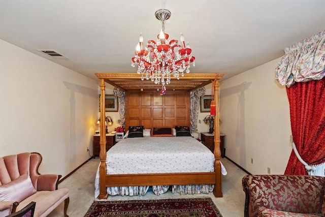 bedroom with a notable chandelier and light carpet