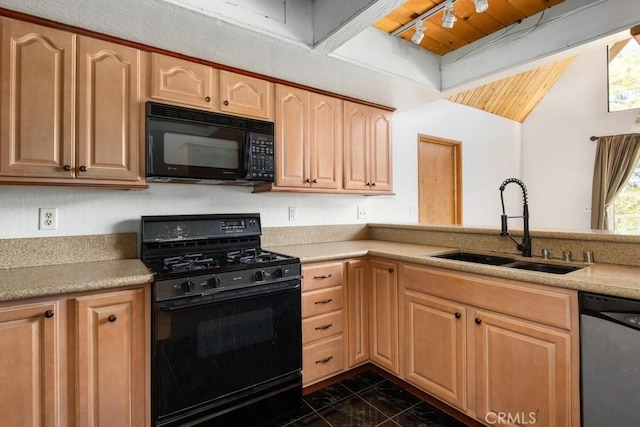 kitchen with black appliances, dark tile patterned floors, sink, and light brown cabinets