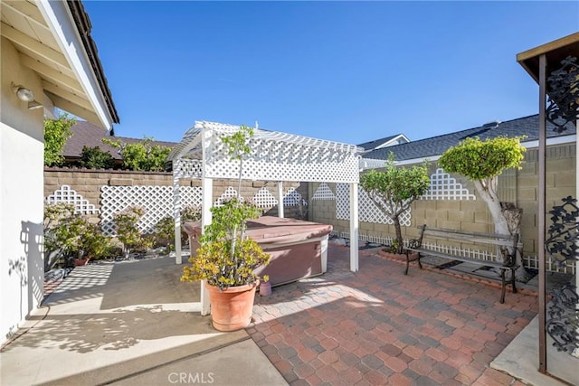 view of patio / terrace featuring a hot tub