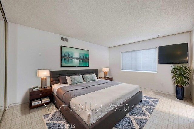 bedroom with a textured ceiling