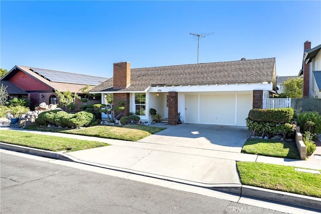 ranch-style home with a garage