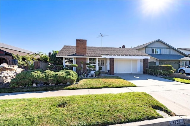 view of front of house with a garage and a front yard