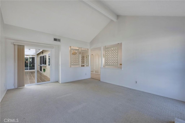 spare room featuring carpet floors, beamed ceiling, and high vaulted ceiling