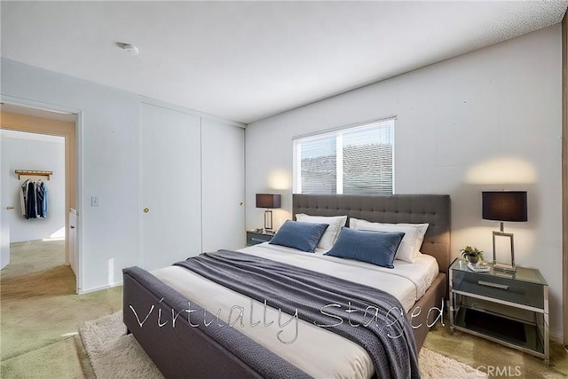 carpeted bedroom featuring a closet