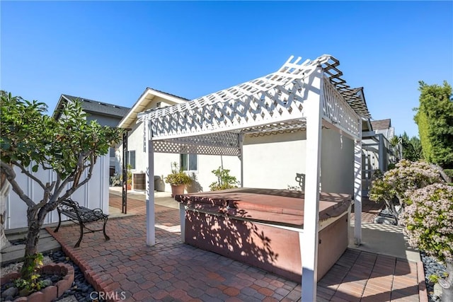 view of patio featuring central air condition unit and a hot tub