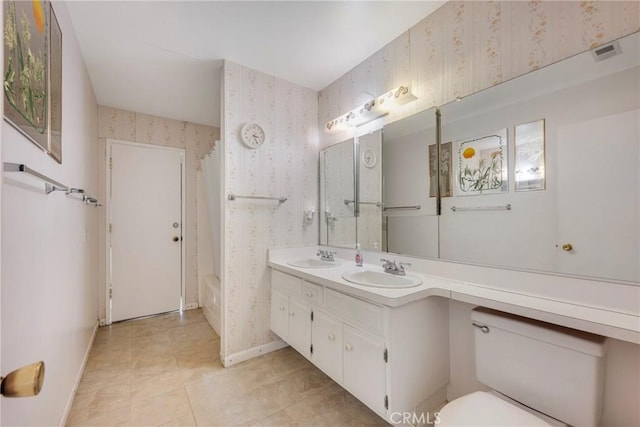 bathroom with toilet and vanity