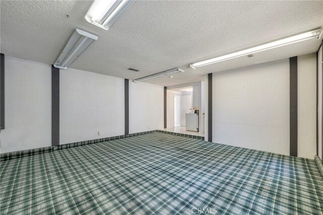 basement with a textured ceiling