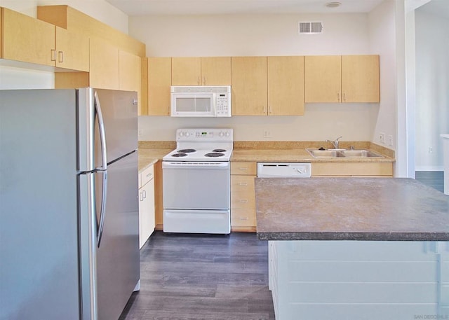 kitchen featuring dark wood-type flooring, white appliances, sink, and light brown cabinets