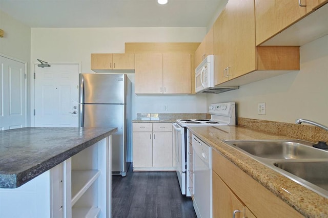 kitchen featuring dark wood-type flooring, white appliances, sink, and light brown cabinets