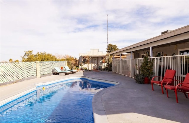 view of swimming pool featuring a patio