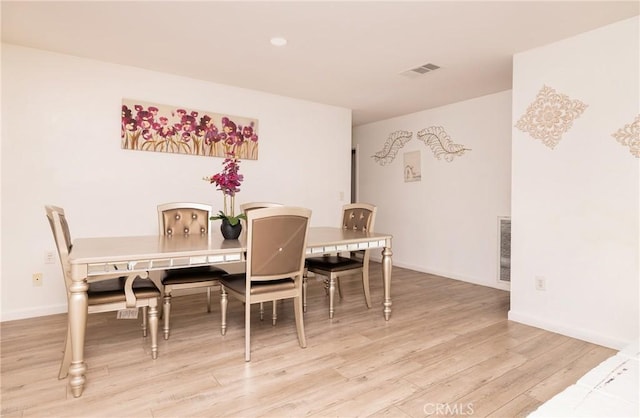 dining area featuring hardwood / wood-style flooring