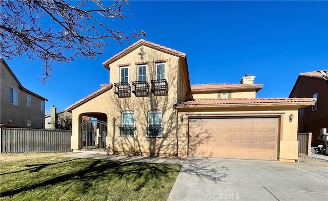 mediterranean / spanish-style home featuring a front lawn, a balcony, and a garage