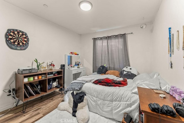 bedroom with light hardwood / wood-style floors