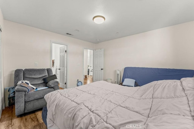 bedroom featuring wood-type flooring