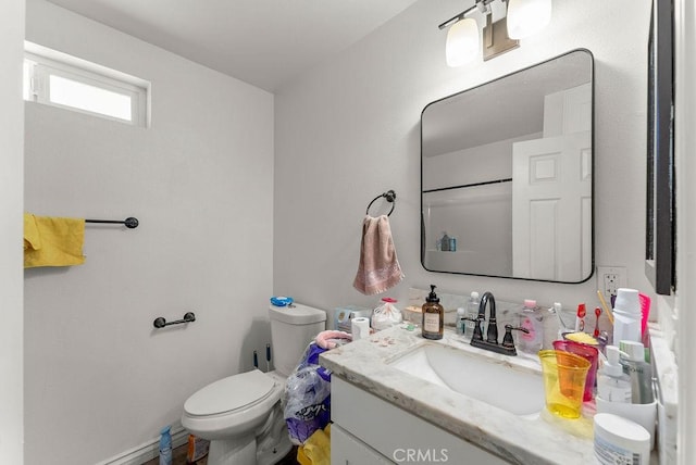 bathroom with toilet and vanity