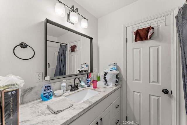 bathroom with vanity and curtained shower